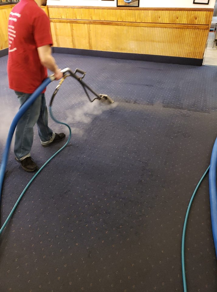 Employee Cleaning Carpets
